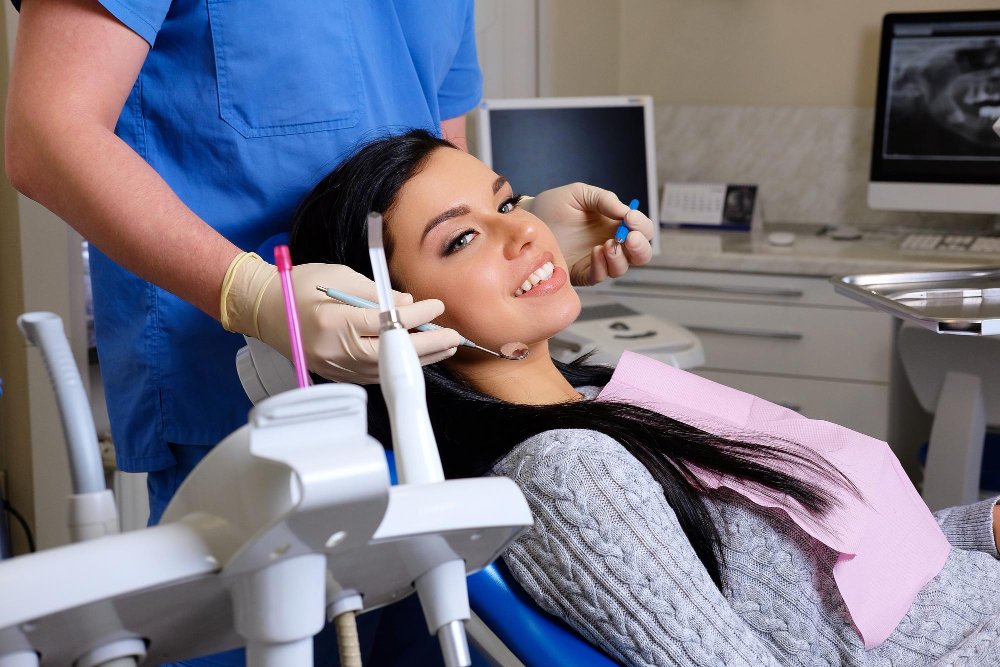 dentist-curing-female-patient-dentist-office-dentistry-care-woman-visit