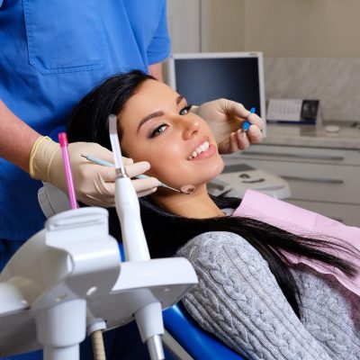 dentist-curing-female-patient-dentist-office-dentistry-care-woman-visit